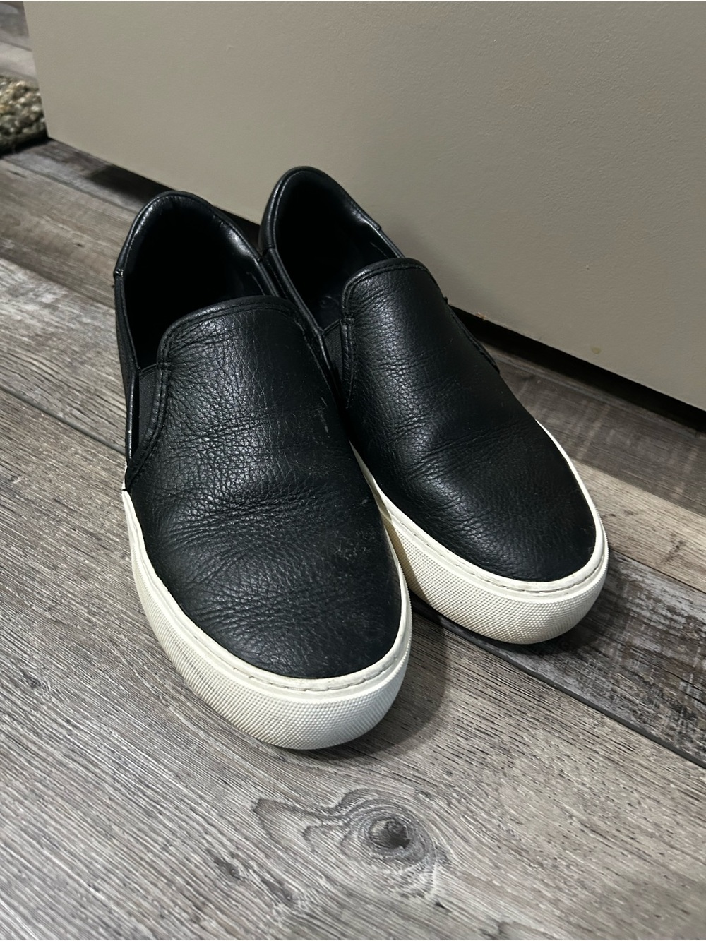 UGG Jass Black Leather Slip-On Sneakers with White Sole platform